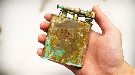 odd tinkering face|Large Lighter restoration with 24 Karat gold plating .